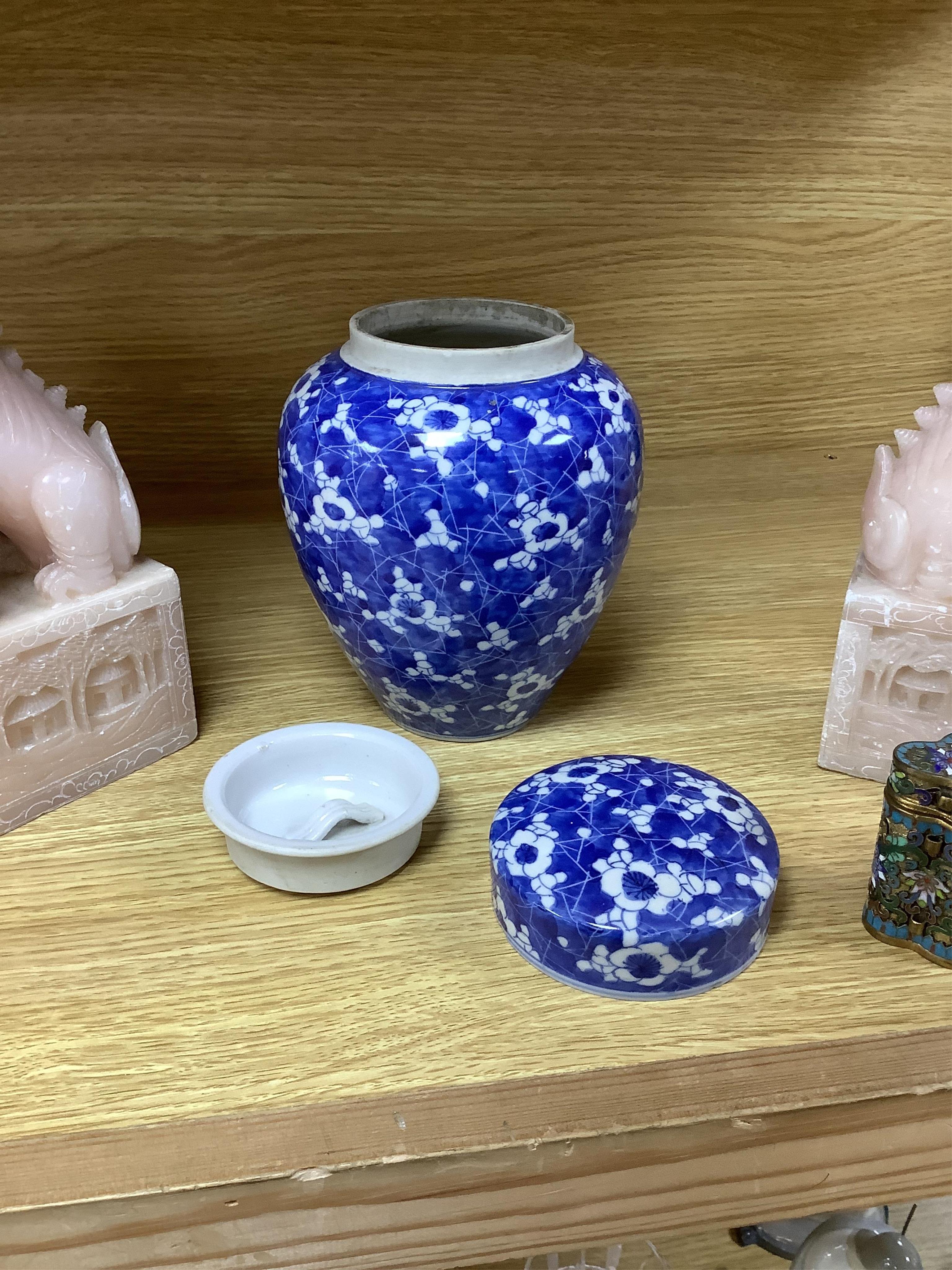 A pair of Chinese soapstone lion-dogs - 22.5cm high, two cloisonné enamel boxes and covers and a blue & white jar & cover